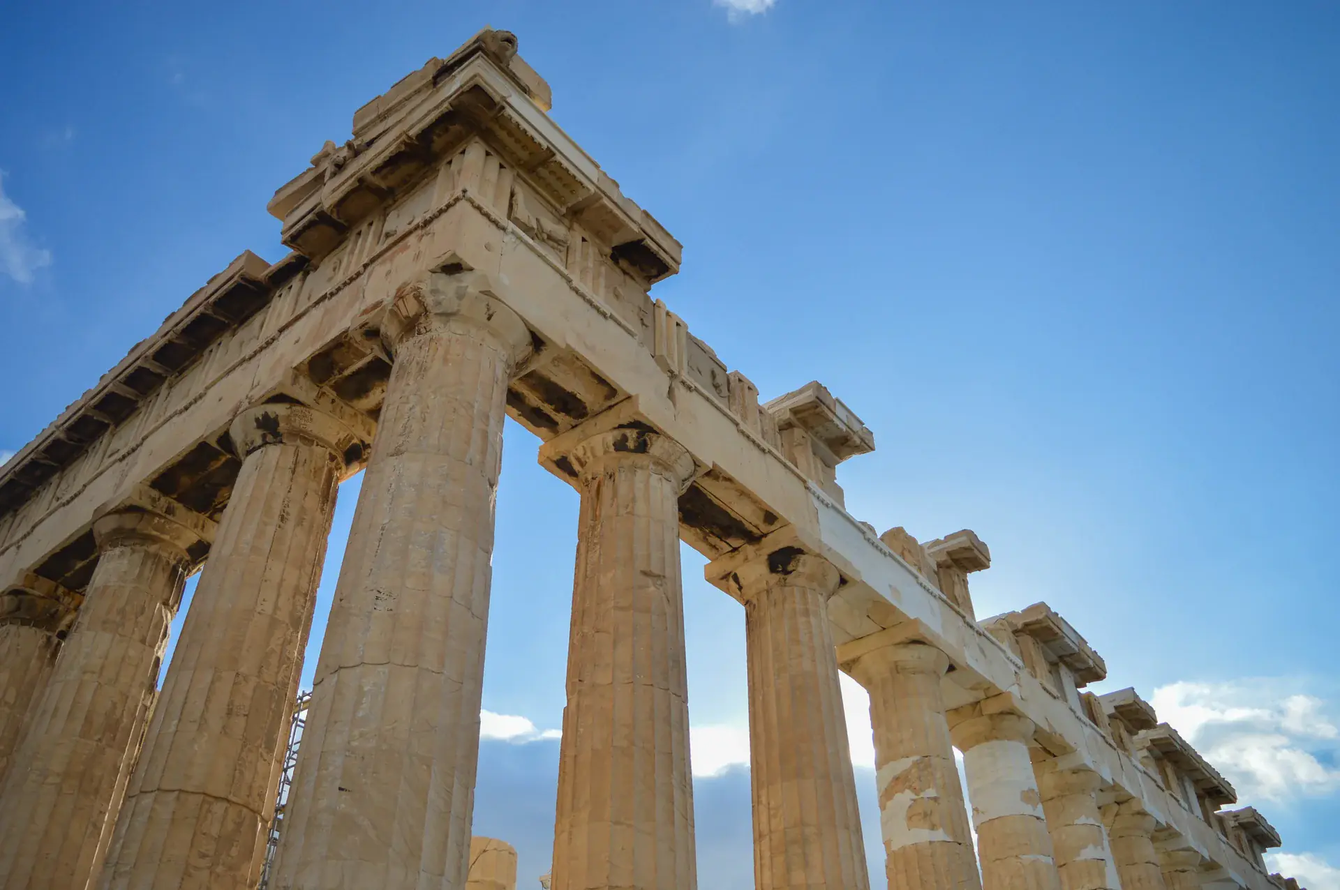 North-east view of the Parthenon temple showing its iconic Doric columns and classical Greek architecture against the Athens skyline