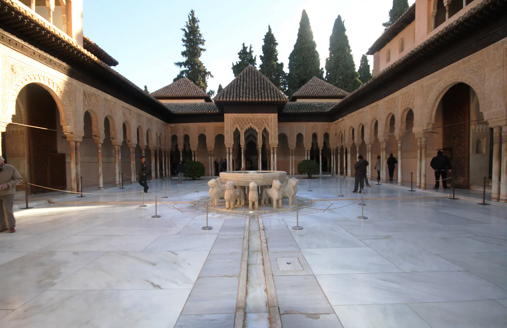 Iconic Court of Lions courtyard with marble fountain and surrounding arcades at Alhambra palace