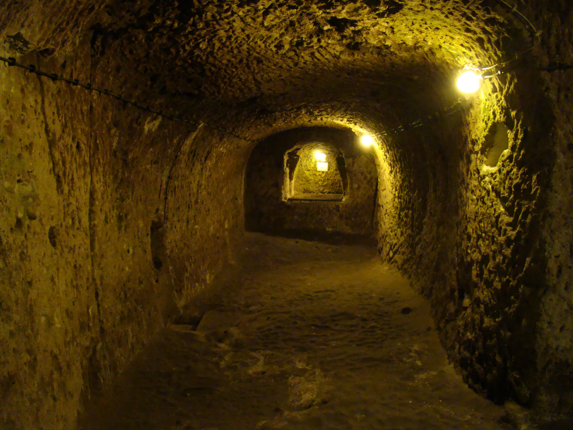 Ancient carved stone tunnels and chambers of Derinkuyu underground city extending deep beneath Cappadocia