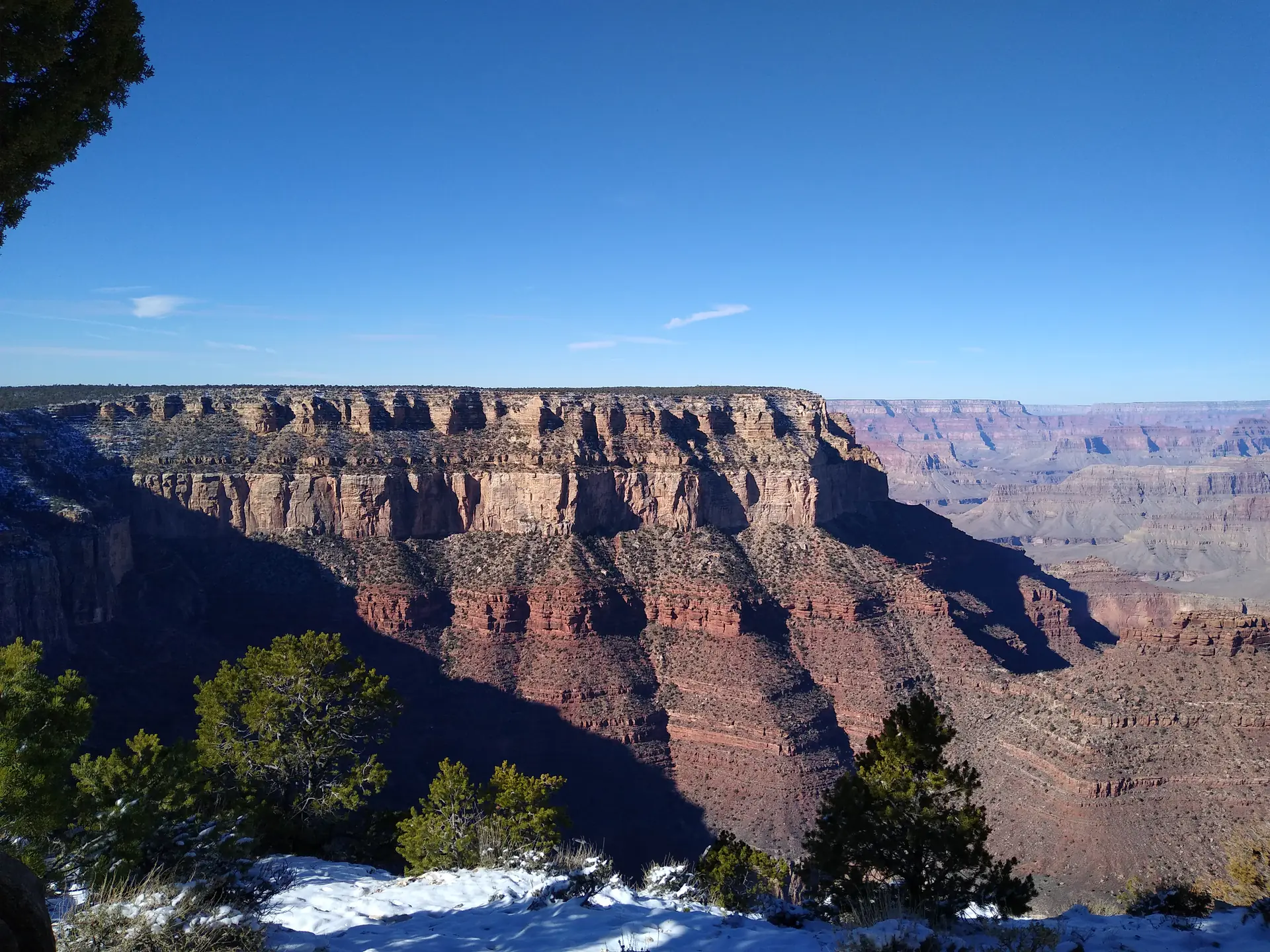 Grand Canyon rock layers with labelled formations including Kaibab, Toroweap, Coconino Sandstone, and Hermit showing 2 billion years of geological history