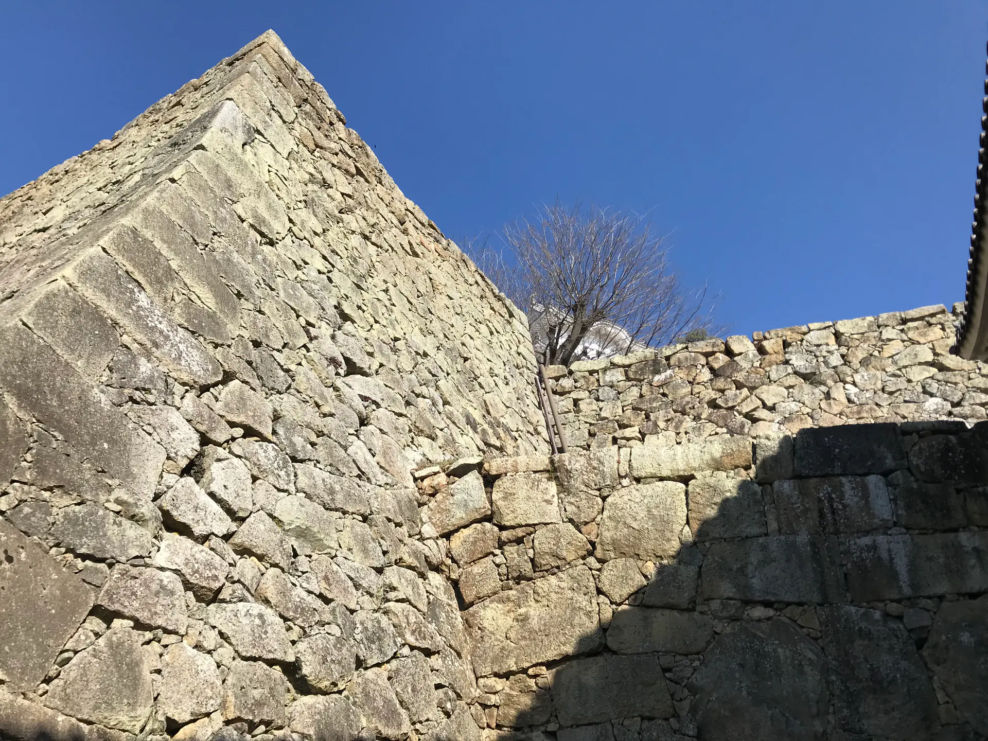 Narrow passageways and defensive gates in Himeji Castle's maze-like bailey system
