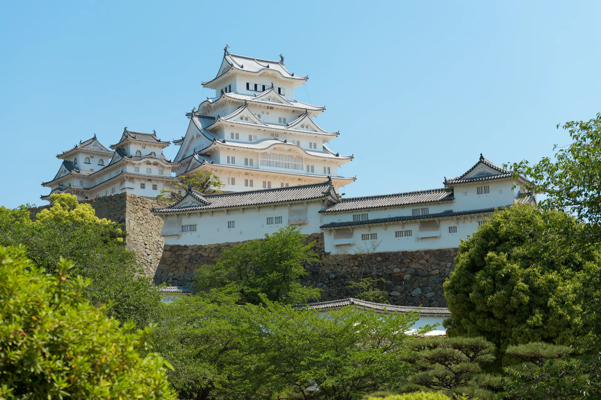 Close-up of Himeji Castle's distinctive white plaster walls and elegant curved rooflines