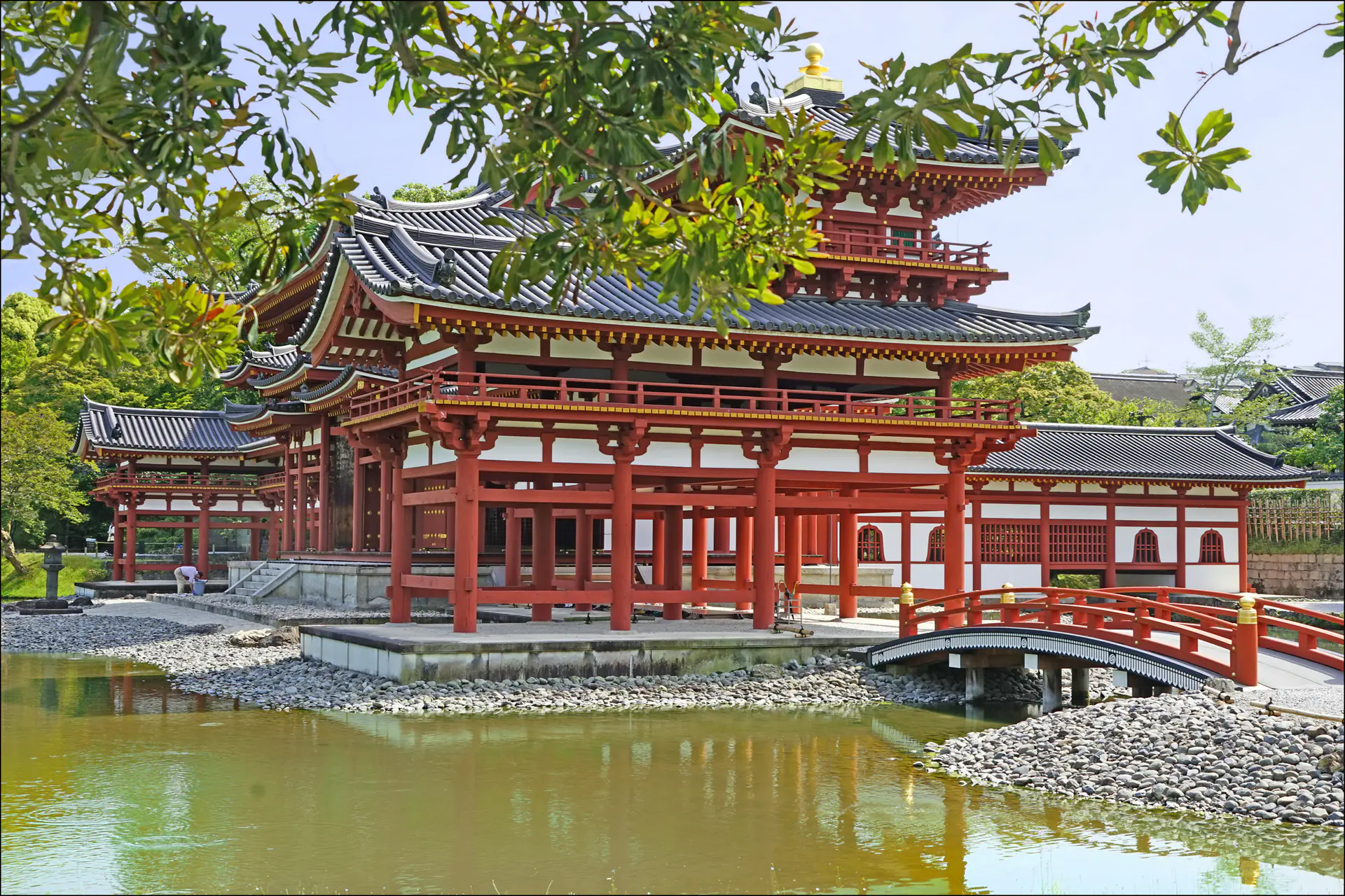 The elegant Byōdō-in Phoenix Hall with its symmetrical wings reflected in the pond, showcasing Heian period Pure Land Buddhist architecture