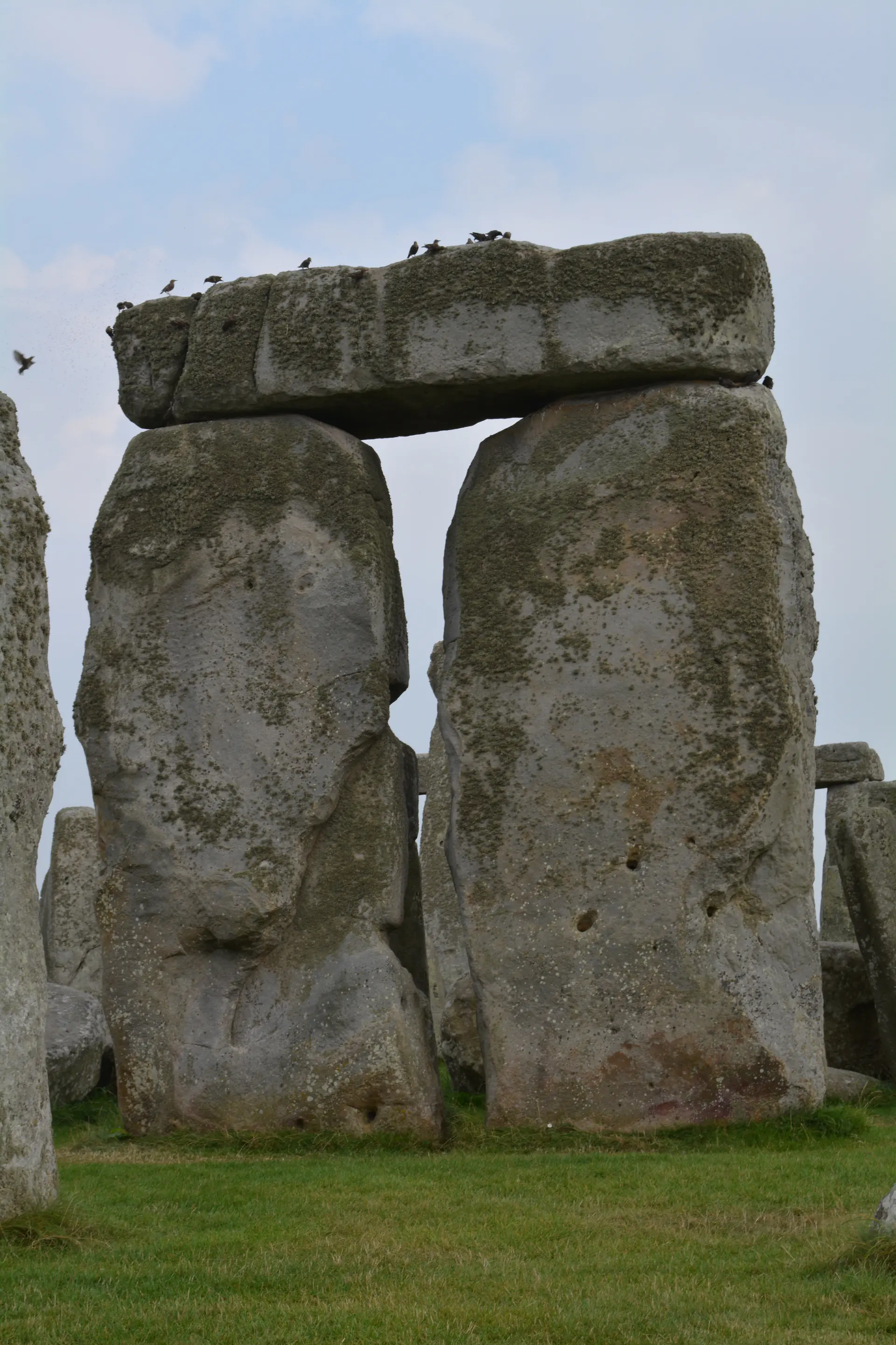 Close-up view of a Stonehenge trilithon showing the massive sarsen stones and precise mortise and tenon construction joints