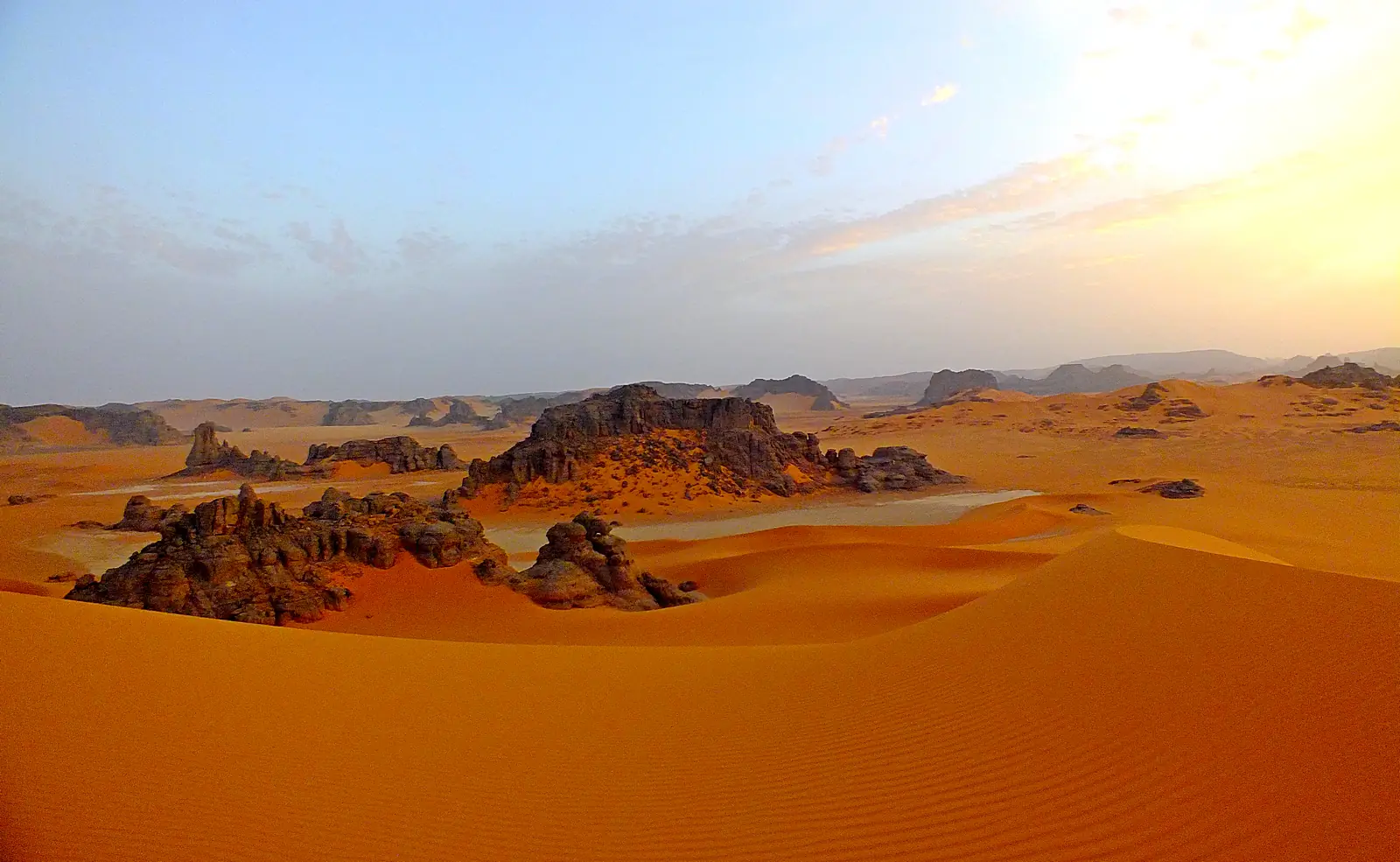Dramatic rocky terrain and sandstone formations at Tassili n'Ajjer National Park showing the distinctive eroded landscape of the Saharan plateau