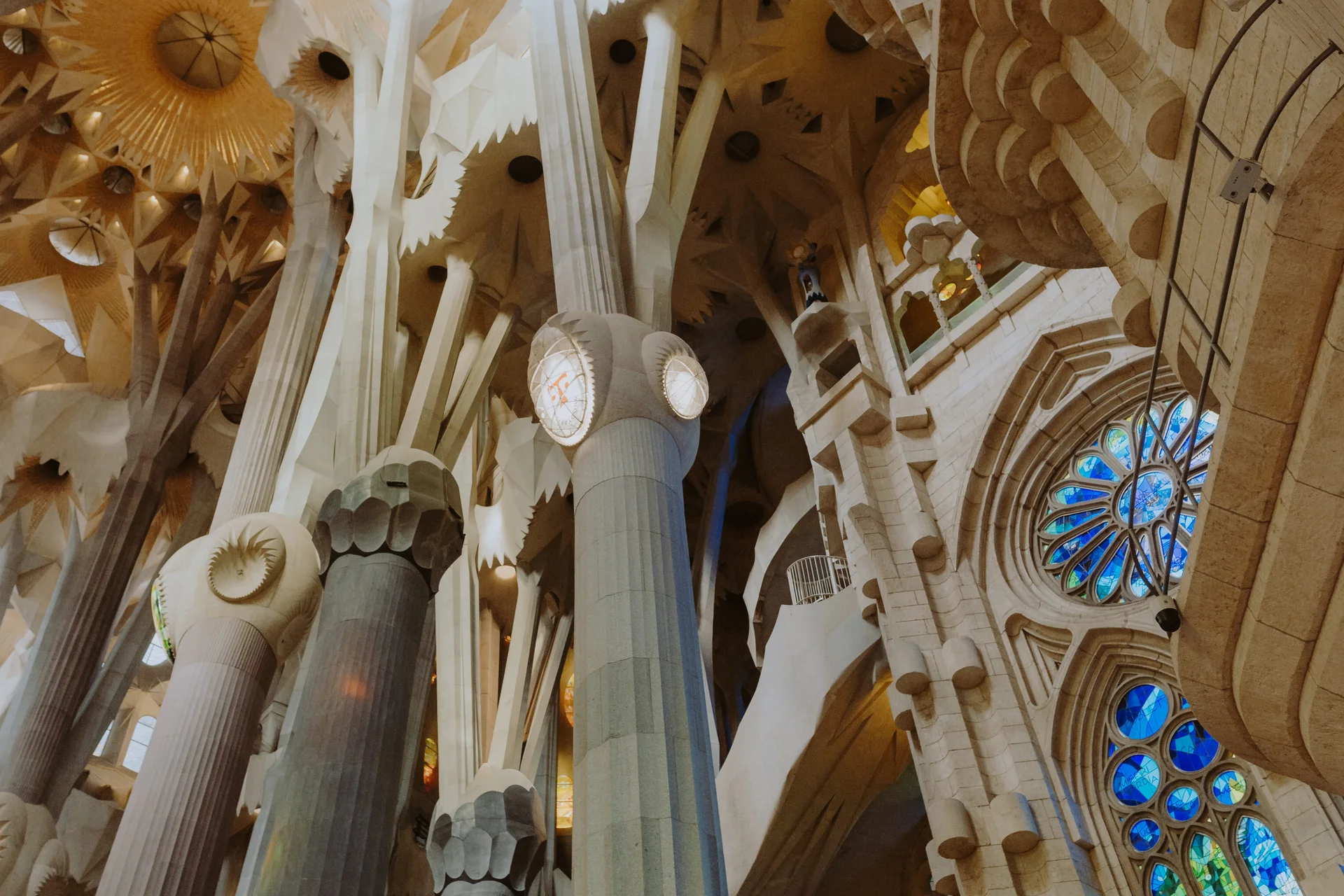 Complete exterior view of Sagrada Família basilica showing the towering spires and intricate facades of Antoni Gaudí's architectural masterpiece