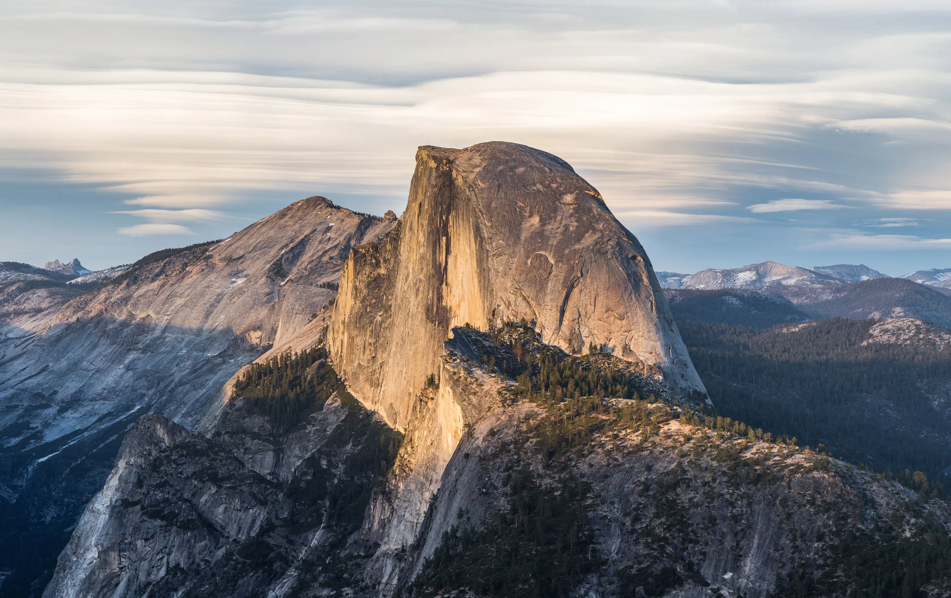 Majestic Half Dome granite formation viewed from Glacier Point showing classic glacial valley formation and mountain wilderness